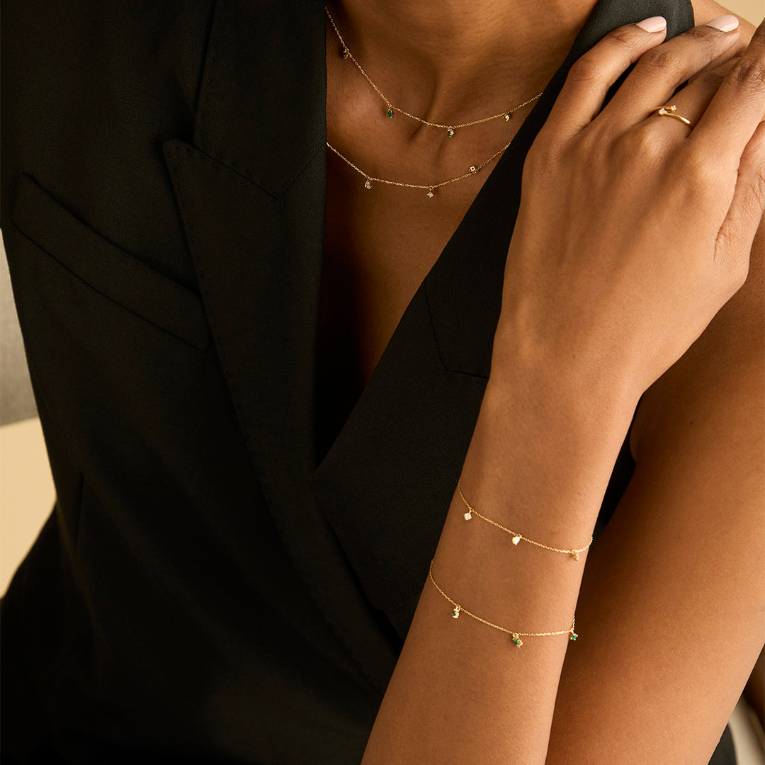 diamond charm bracelet in solid gold 